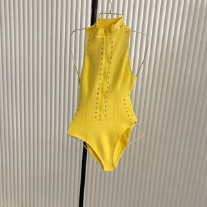 GIGI C Yellow High-Neck One-Piece with Front Zip and Laser Cut Detail